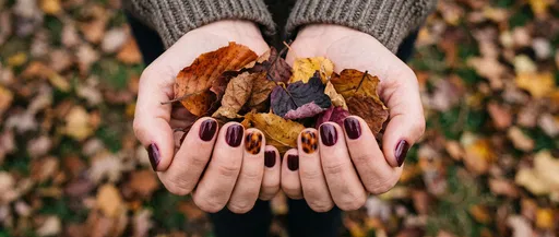 Cupped Hands With Burgundy Autumn Nails
