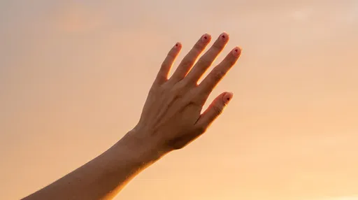 Hand With Heart Nail Art At Sunset
