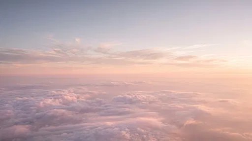 Soft Pink Dawn Above Clouds