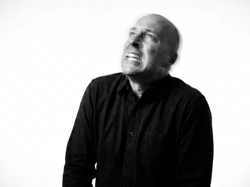 Monochrome Portrait of Grimacing Bald Man