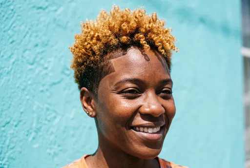 Smiling Woman With Blonde Tapered Afro