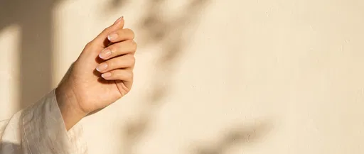 Hand With Lavender Micro French Nails