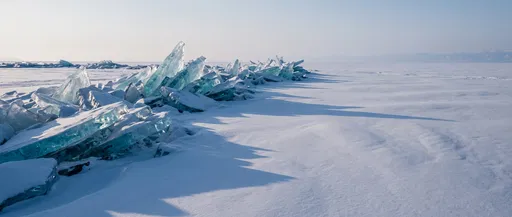 Turquoise Ice Hummocks on Frozen Lake