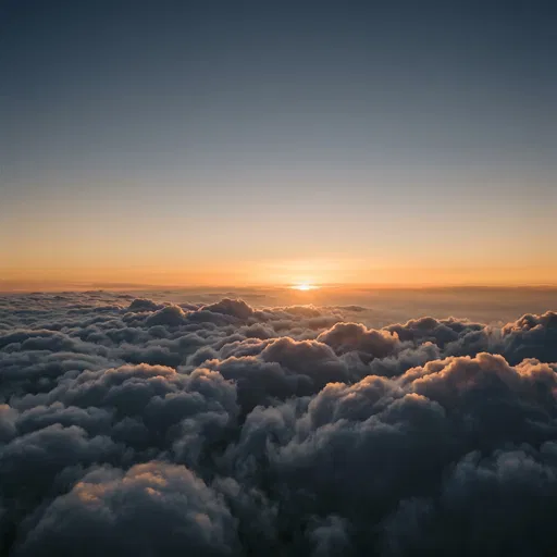 Golden Hour Sunset Above Fluffy Clouds