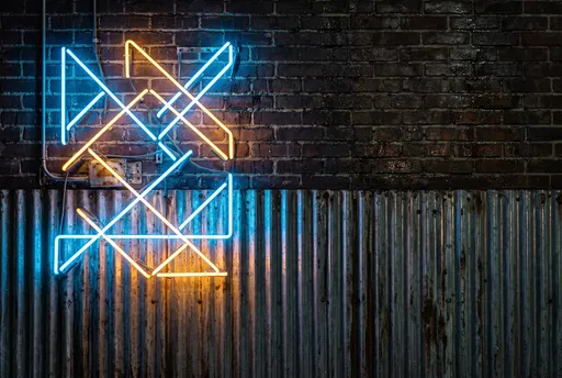 Geometric Neon Lights on Industrial Wall