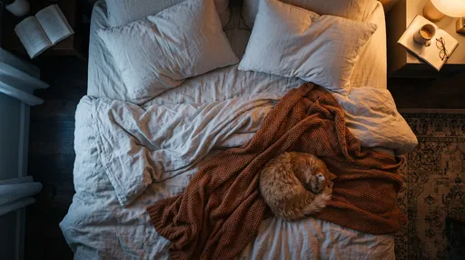 Ginger Cat Sleeping on Cozy Bed
