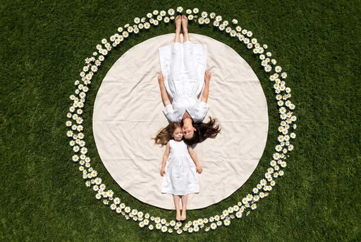 Mother and Daughter Lying on Blanket