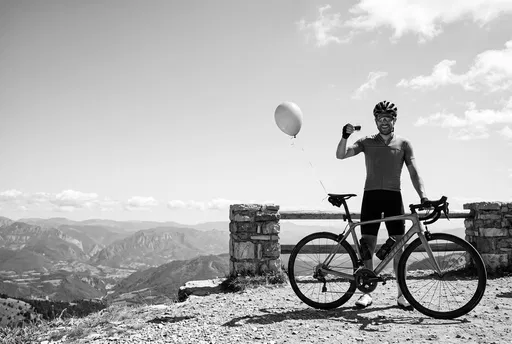 Cyclist Celebrating at Mountain Overlook