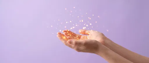 Cupped Hands Holding Glowing Lights