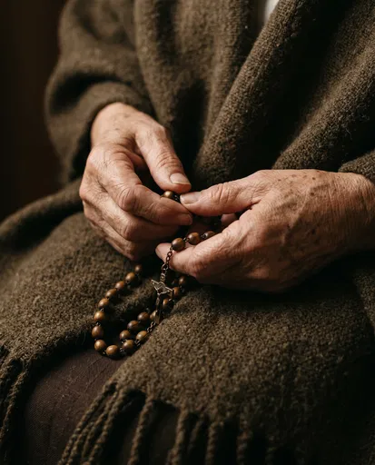 Elderly Hands Holding Wooden Rosary Beads