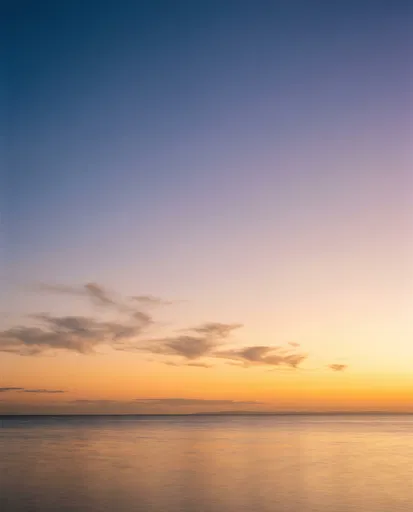 Calm Golden Sunset Over Smooth Ocean