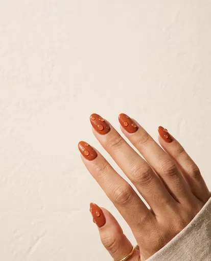 Rust Orange Manicure With Water Droplets
