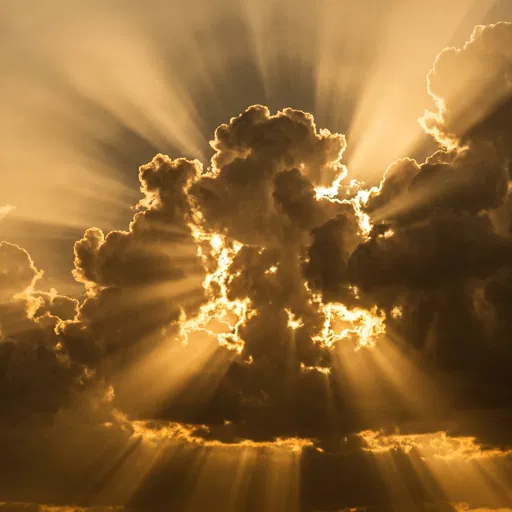 Golden Sunbeams Breaking Through Dark Clouds