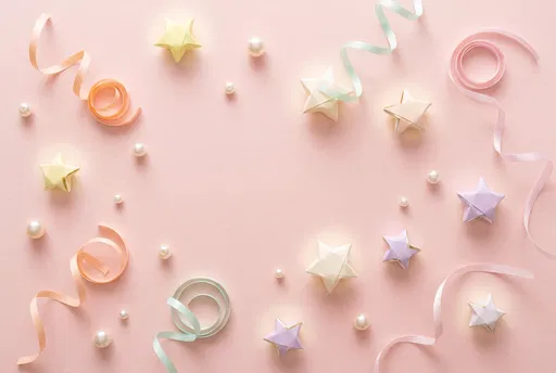 Pastel Paper Stars and Ribbons Flat Lay