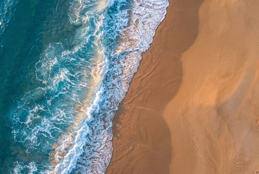Aerial View of Ocean Waves on Beach