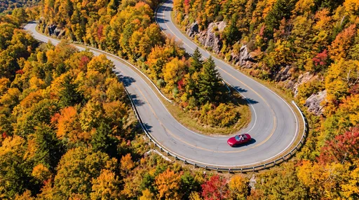 Red Convertible on Winding Autumn Mountain Road