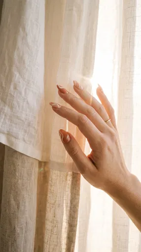 Hand With Terracotta Swirl Nails in Sunlight