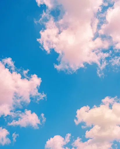 Pastel Pink Clouds in Blue Sky