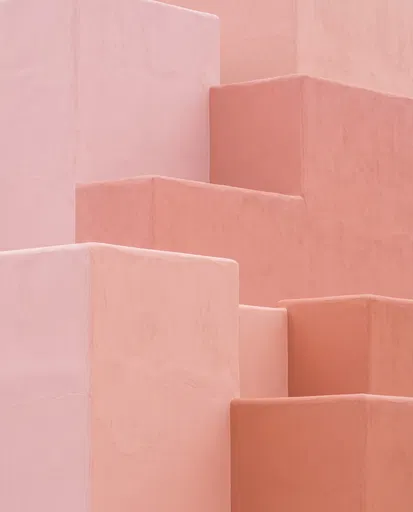Pastel Pink and Coral Stepped Adobe Wall