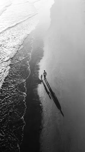 Father and Child Walking on Beach