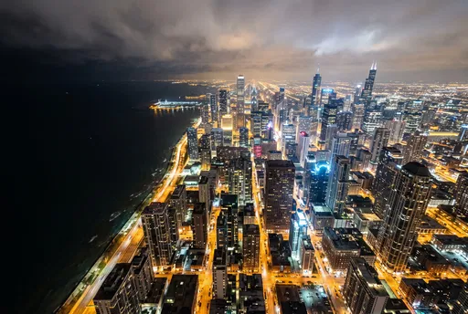 Aerial Night View of Coastal City Skyline