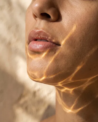 Macro Lips With Golden Water Caustics