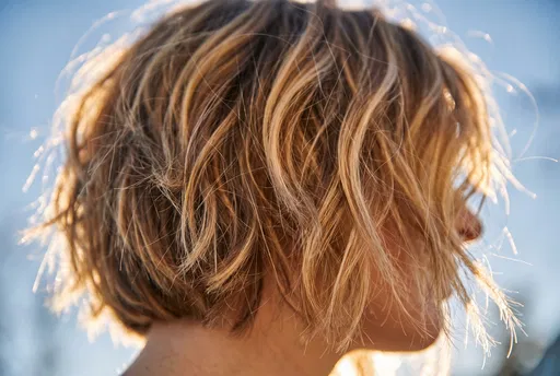 Backlit Golden Blonde Textured Bob Haircut