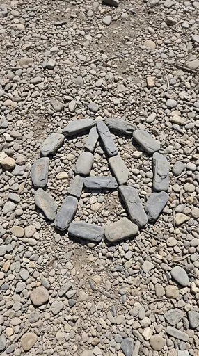 Anarchy Symbol Made of River Stones