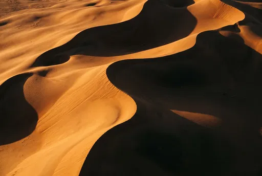 Golden Hour Desert Sand Dunes and Shadows