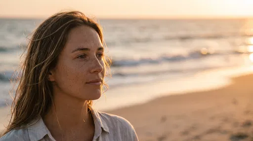 Woman Gazing at Ocean During Sunset
