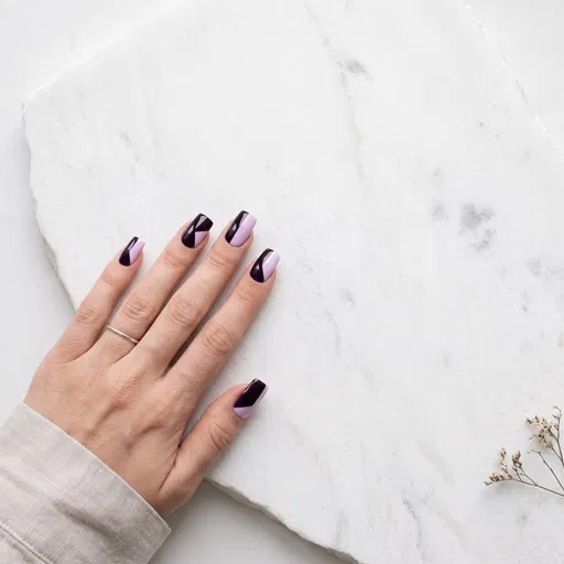 Geometric Purple Nail Art on White Stone