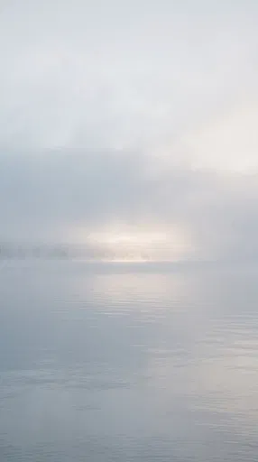 Calm Sea Merging Into Morning Fog