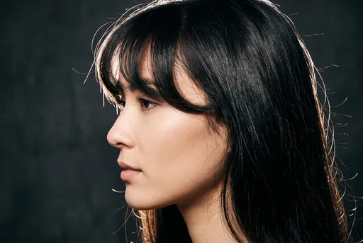 Side Profile Woman With Wispy Bangs