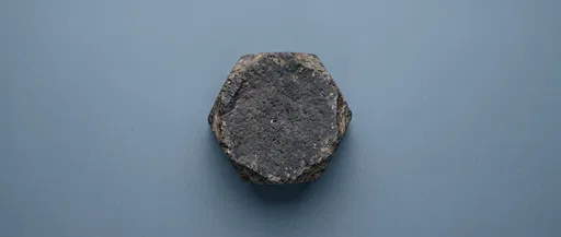 Hexagonal Basalt Stone on Blue Background