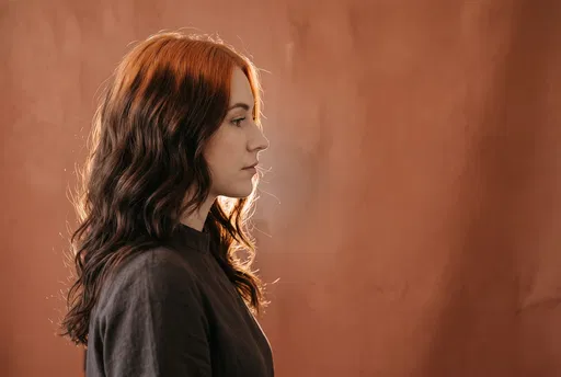 Profile Portrait of Woman with Copper Roots