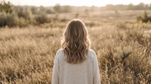 Woman with Wavy Balayage Hair in Meadow