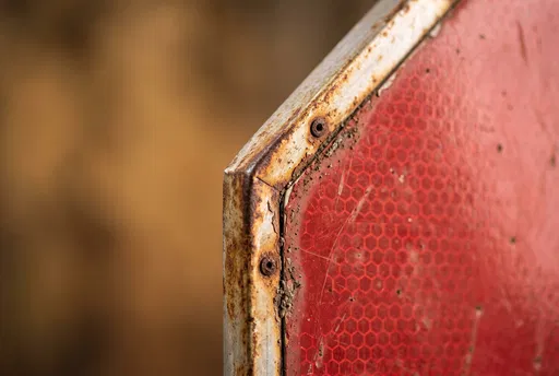 Macro Rusted Red Octagonal Sign Corner