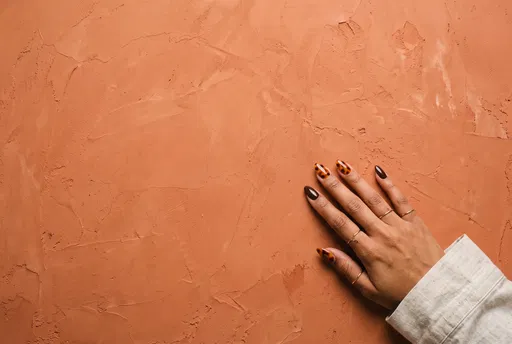 Tortoiseshell Manicure on Terracotta Background