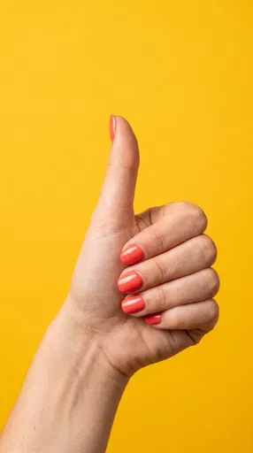 Woman Hand Giving Thumbs Up Gesture