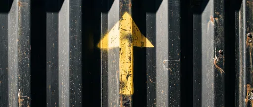 Yellow Up Arrow on Shipping Container