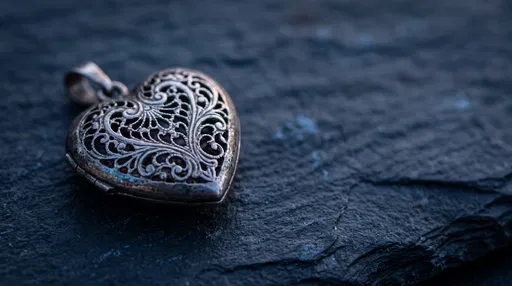 Antique Silver Filigree Heart Locket on Slate