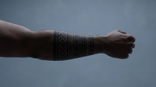 Male Forearm With Geometric Band Tattoo