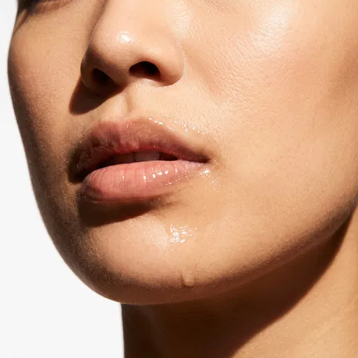 Macro of Glossy Lips and Dewy Skin
