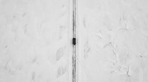 Aerial View of Vehicle on Ice Road