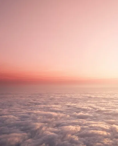 Aerial View Over Pink Sunset Clouds