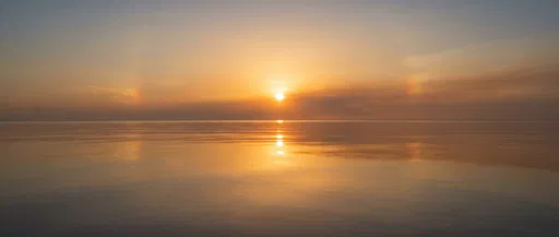 Golden Sunset Over Calm Glassy Ocean