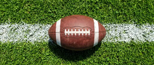 Overhead View of American Football on Field Line