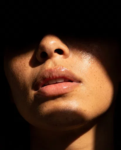 Close-Up of Glossy Lips in Sunlight