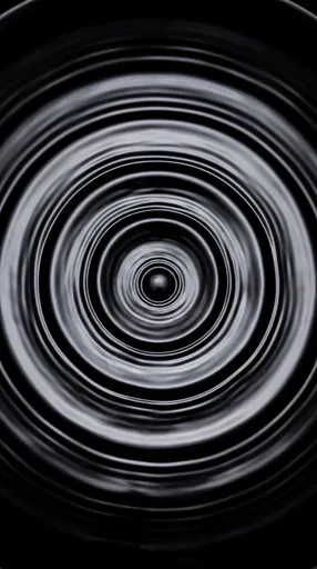 Concentric Black Liquid Ripples Overhead