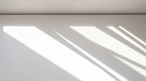 Minimalist White Surface With Diagonal Sunlight Shadows